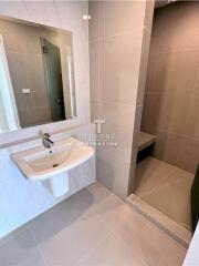 Modern bathroom with sink and walk-in shower