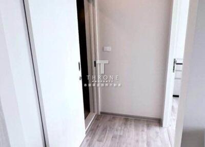 Hallway with wooden flooring and sliding doors