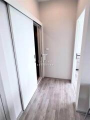 Hallway with wooden flooring and sliding doors