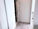 Hallway with wooden flooring and sliding doors