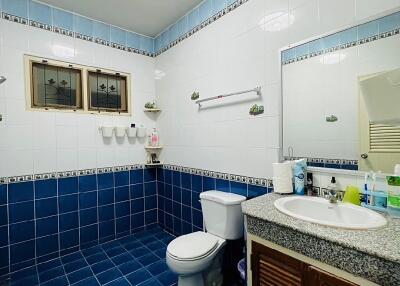 Modern bathroom with blue and white tiles