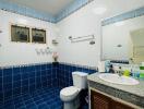 Modern bathroom with blue and white tiles