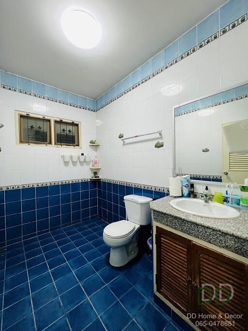 Modern bathroom with blue and white tiles