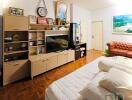 Spacious living room with wooden flooring and a cozy sofa