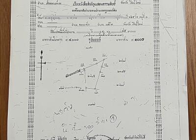 Property ownership document with various handwritten notes and official stamps.