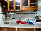 Kitchen with wooden cabinets, counter space, and various appliances