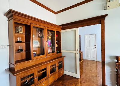 Living room with wooden cabinet and wooden flooring