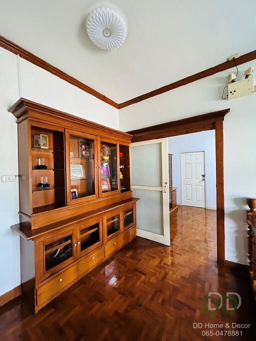 Living room with wooden cabinet and wooden flooring