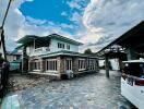 Two-story house with paved driveway and attached garage