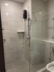 Modern bathroom with glass shower partition and water heater
