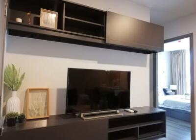 Modern living room with TV and shelves