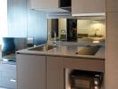 Modern compact kitchen with integrated appliances