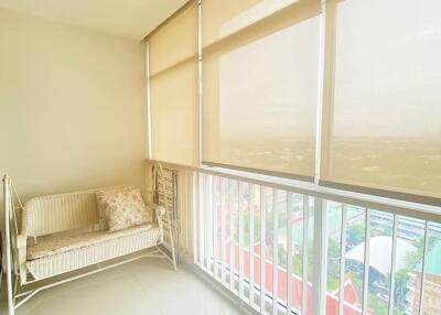 Bright and airy balcony with blinds and seating