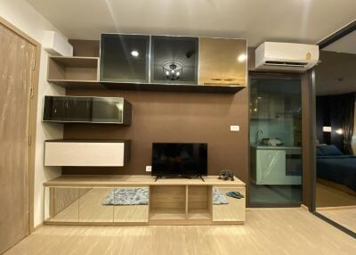 Modern living room with built-in entertainment center and air conditioning