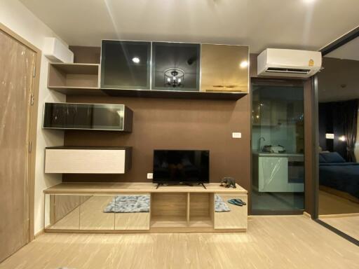 Modern living room with built-in entertainment center and air conditioning