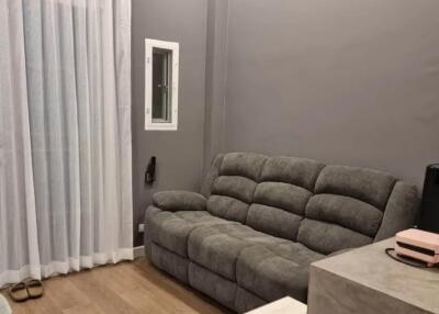 Living room with gray sofa and small table