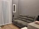 Living room with gray sofa and small table