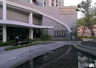 Main entrance of a modern building with a sign that reads 