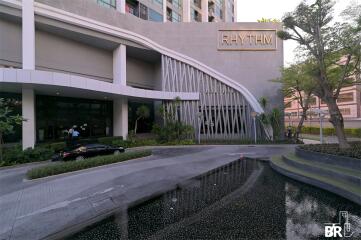 Main entrance of a modern building with a sign that reads 