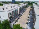 Aerial view of modern townhouses with driveways