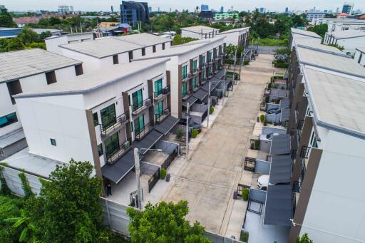 Aerial view of modern townhouses with driveways