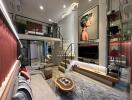 Elegant and modern main living area with loft, large art piece, and stylish furnishings