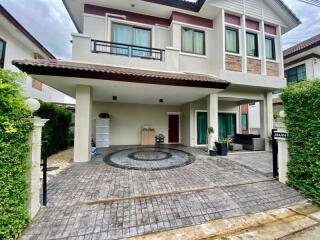 Front view of modern double-story house with driveway