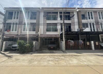 Front view of a three-story residential building