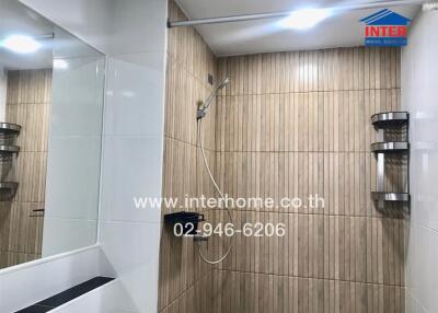 Modern bathroom with wooden tiles and shower area