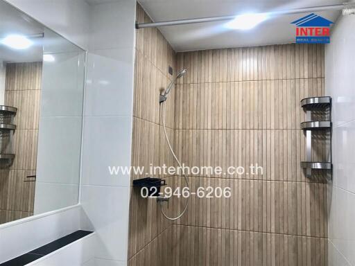 Modern bathroom with wooden tiles and shower area