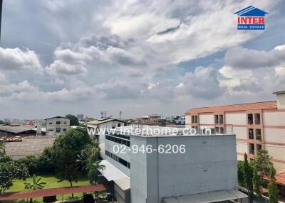 View of surrounding buildings and sky from the property