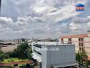 View of surrounding buildings and sky from the property