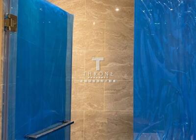 Modern bathroom with blue glass shower doors