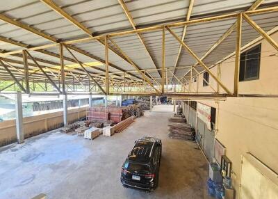 Warehouse interior with parked vehicle