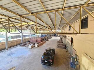 Warehouse interior with parked vehicle