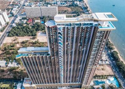 Aerial view of a high-rise beachfront condominium building