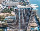 Aerial view of a high-rise beachfront condominium building