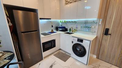 Modern compact kitchen with integrated appliances