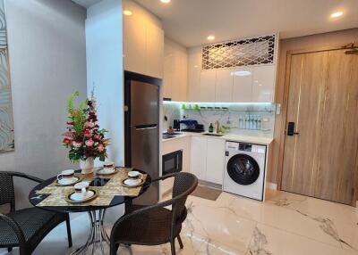 Modern kitchen with dining area and appliances