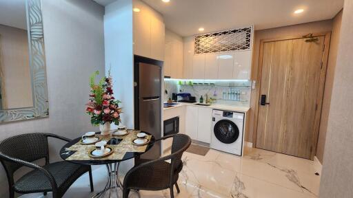 Modern kitchen with dining area and appliances