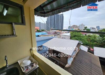 Balcony view of urban residential area with visible city skyline in the background