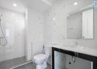 Modern bathroom with white tiles and shower