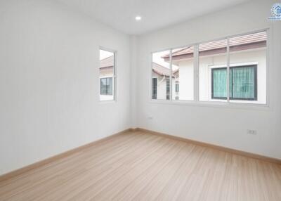 Empty bedroom with large windows
