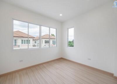 Bright and airy bedroom with large windows