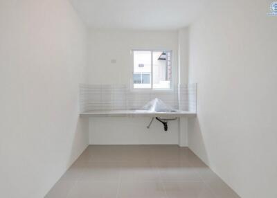 Clean and minimalistic utility room with window