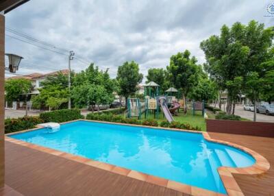 Outdoor pool area with playground