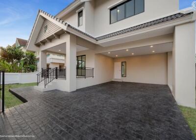 Modern two-story house with large carport and porch