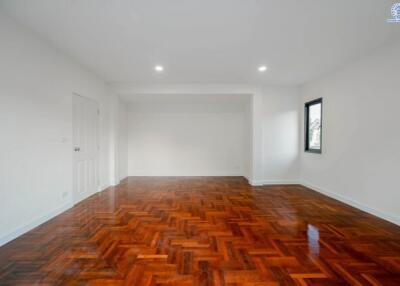 Spacious living room with hardwood flooring