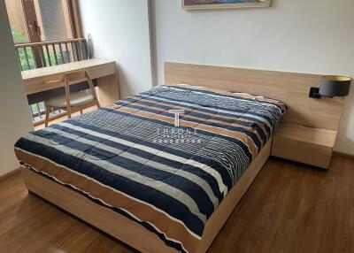 Bedroom with wooden floor and modern furniture