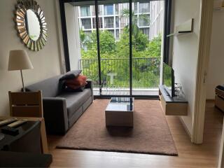 Modern living room with large window and outdoor view